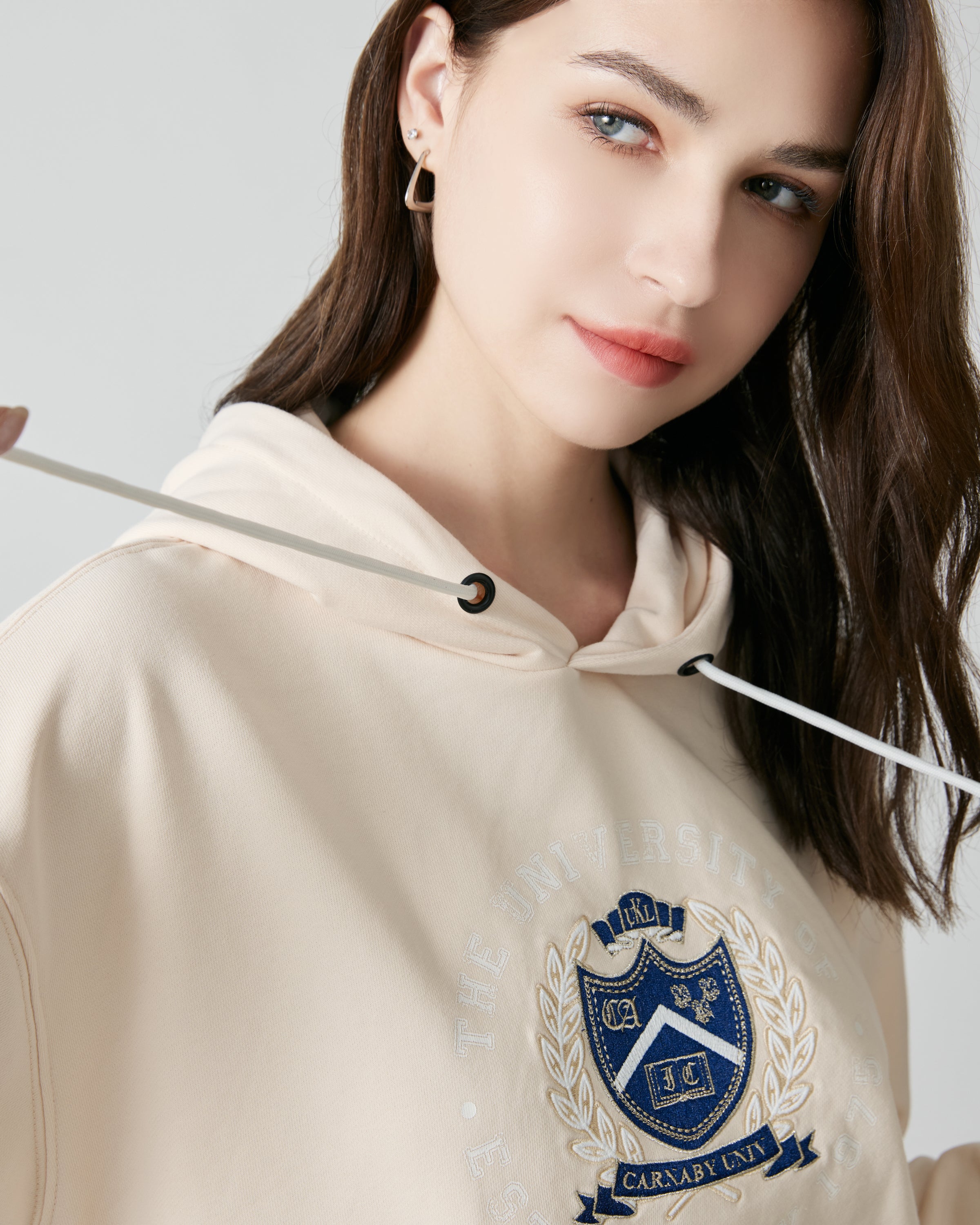 University of Carnaby hooded drop-shoulder badge embroidered drawstring sweatshirt